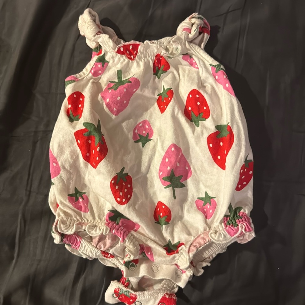 White with pink and red strawberry romper 
3-6 months